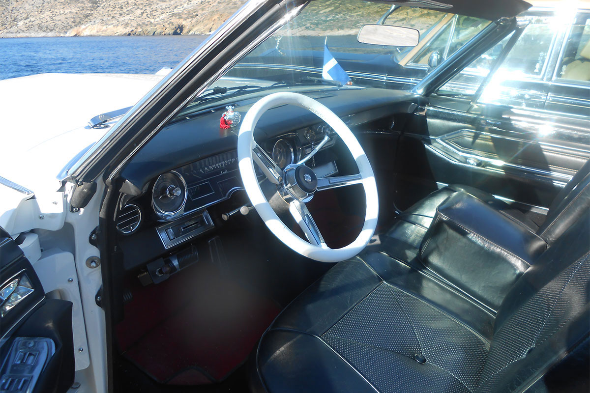 Transportation with an antique car at Sifnos