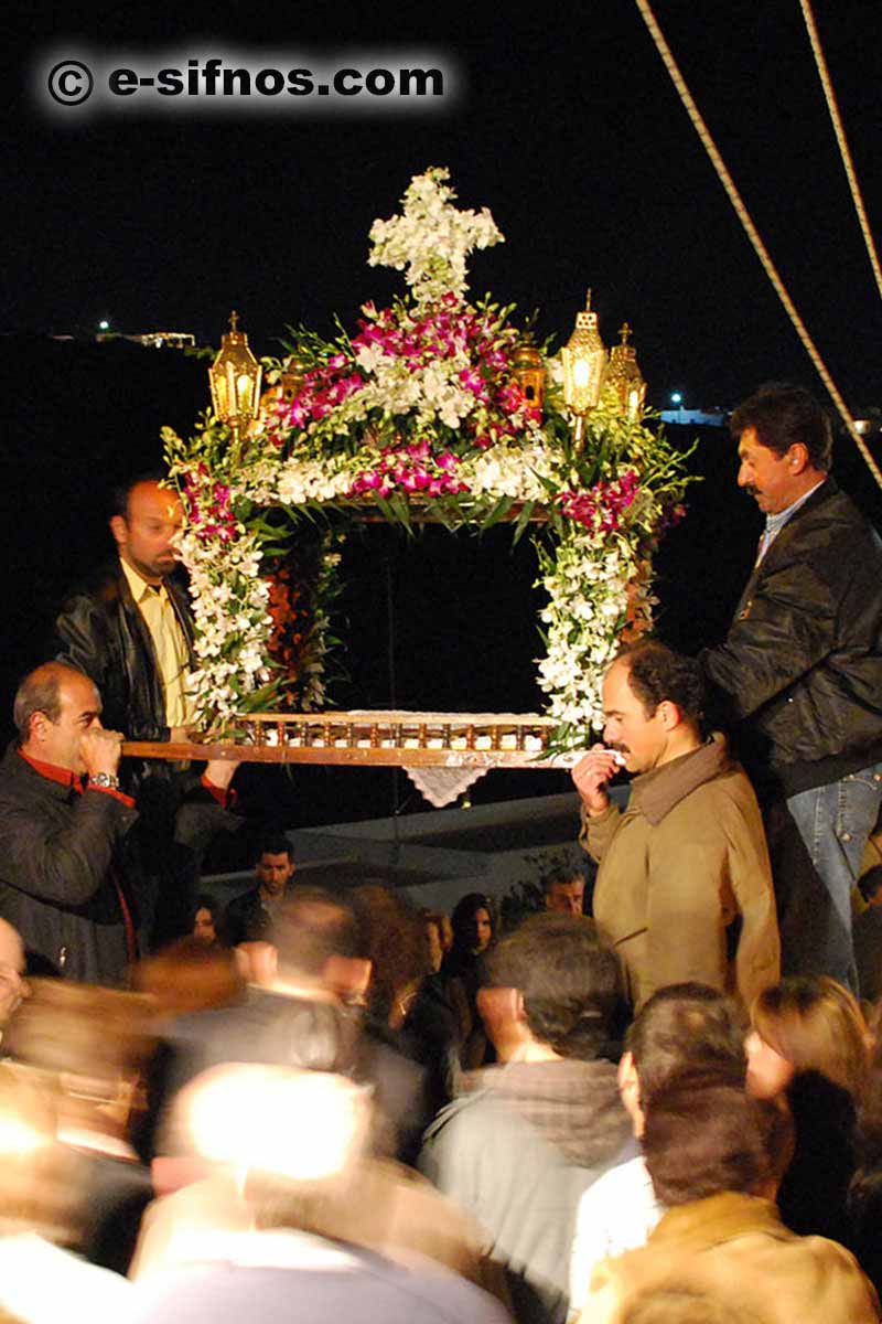 Men holding the Epitaph for people to pass under